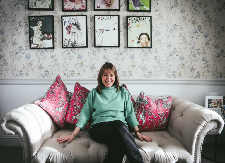 Jeanette sitting on a sofa in a relaxed position